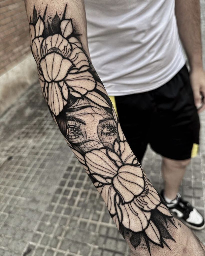 girl behind flowers blackwork sleeve tattoo