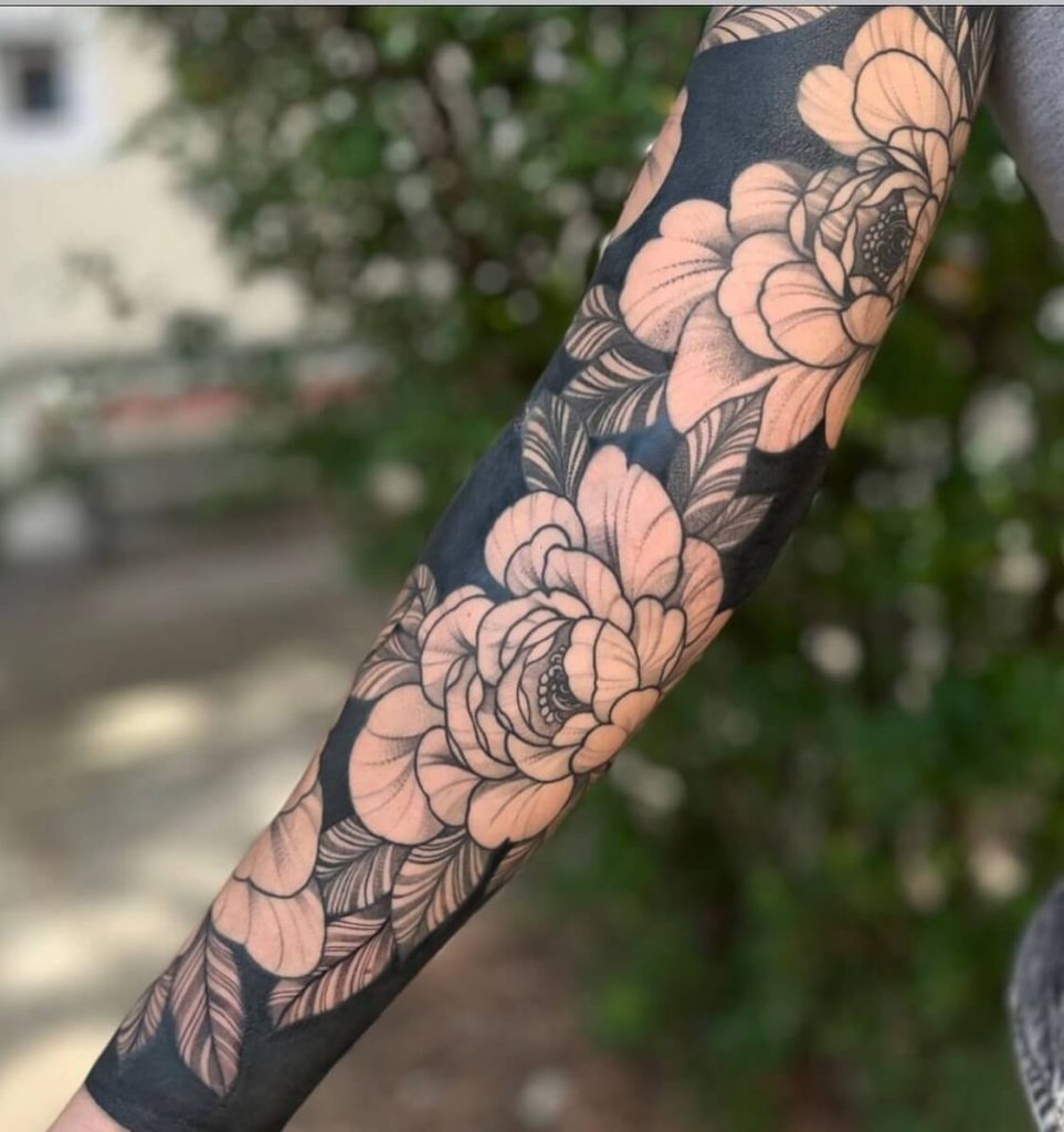 Floral sleeve blackwork tattoo