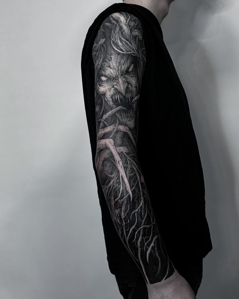 Dark scary sleeve tattoo